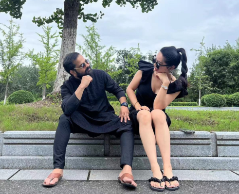 Students performing classical dance on stage